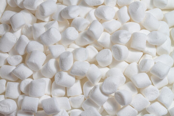 Background of white marshmallows, air souffles of small size. White sweets.