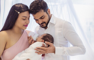 Asian parents with newborn baby, Closeup portrait of asian young couple father mother holding new...