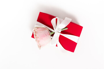 red gift box with a bow and a pink rose on a white background Valentine's Day long size for Facebook