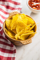Tortilla chips and red tomato salsa dip. Mexican nacho chips.