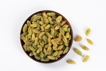Dried fruits, green raisins on white background