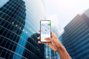 Navigation App. Smartphone With Gps Application On Screen In Black Male Hand