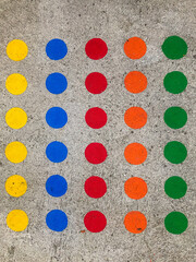 Physical skill game mat with multicolored circles