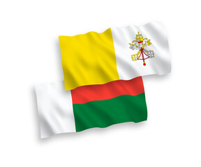 Flags of Vatican and Madagascar on a white background