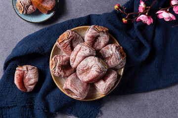 Sweet dried persimmon on table