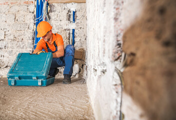 Obraz na płótnie Canvas Construction Worker Inside Remodeled Concrete House Interior