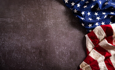 Happy presidents day concept with flag of the United States on dark stone background.