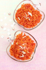 Fototapeta na wymiar gajar ka halwa or carrot halwa is an Indian homemade sweet made from grated carrot and condensed milk