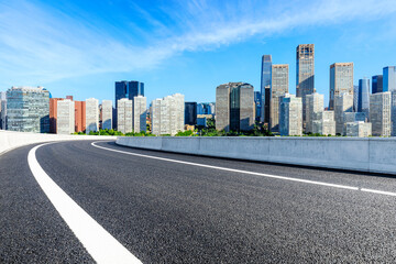 Naklejka premium Asphalt road and modern city commercial buildings in Beijing,China.