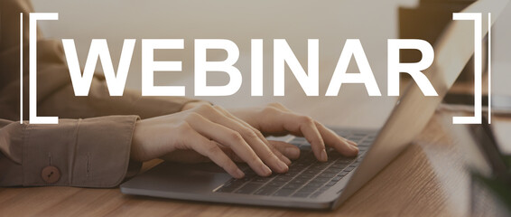 Woman hands on laptop keyboard and webinar text
