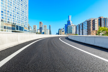 Obraz premium Asphalt road and modern city commercial buildings in Beijing,China.
