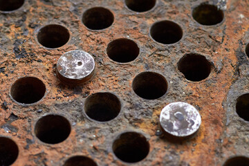 Tube sheet or plate of heat exchanger boiler closeup selective focus background disconnected muted...