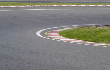 Obraz premium sleek asphalt and danger at the bend of the motorbike track, motoGP