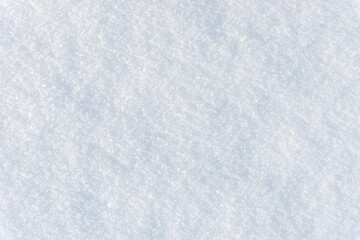 Fototapeta premium White clean shiny snow background texture. fresh snow seamless texture. snowy surface closeup