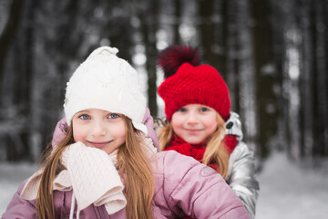 Fototapeta premium Two beautiful little girls sisters are playing