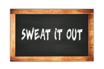 Obraz premium SWEAT IT OUT text written on wooden frame school blackboard.