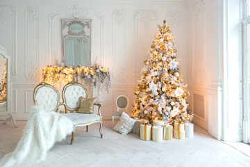 luxurious expensive light interior living room in a royal style decorated with a very beautiful Christmas tree and large windows