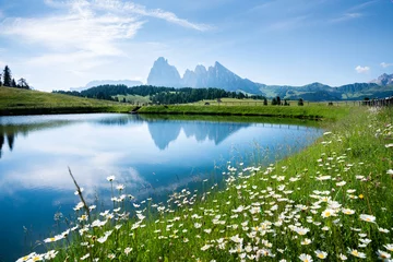 Foto auf Acrylglas Mountain landscape in the Alps with rugged peaks reflecting in alpine lake in summer © JFL Photography