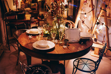Fototapeta na wymiar Served table for Christmas dinner in cozy restaurant