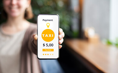 Unrecognizable female showing smartphone with online payment transaction for taxi services © Prostock-studio