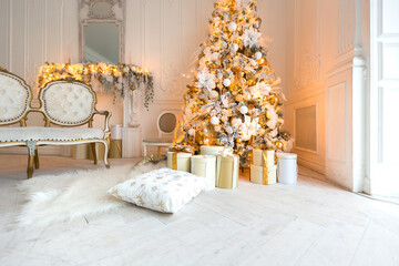 luxurious expensive light interior living room in a royal style decorated with a very beautiful Christmas tree and large windows