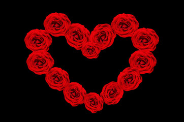 Heart-shaped frame of red roses on a black background. The Concept Of Valentine's Day