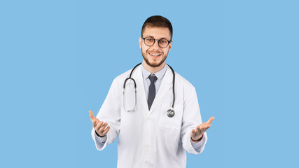 Cheerful Male Doctor In Uniform Talking To Camera, Blue Background