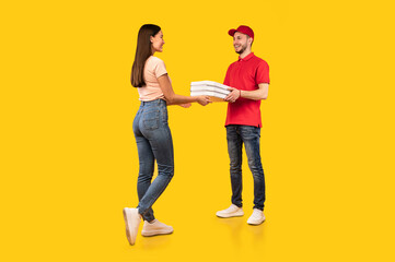 Courier Guy Giving Pizza Boxes To Lady On Yellow Background