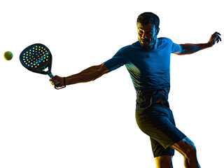 one caucasian mature man Paddle Padel tennis player shadow silhouette in studio isolated on white background - 404850351