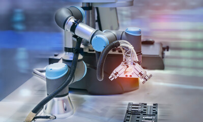 automatic arm catch for electronic assembly line. The robot for smart technology manufacturing process.