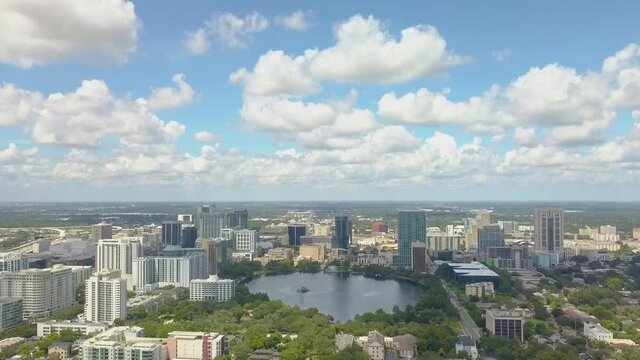 525 Drone of downtown Orlando with lake Eola and clouds