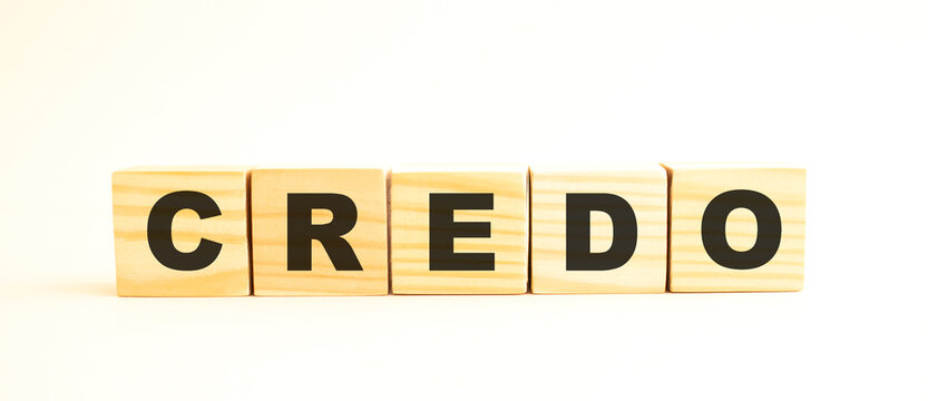 The word CREDO. Wooden cubes with letters isolated on white background.