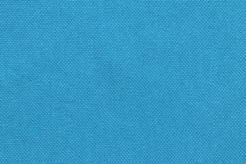 Fototapeta na wymiar Texture of blue fabric for clothing.