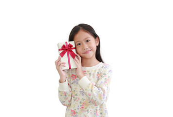 Cute little asian kid girl holding gift box on white background.