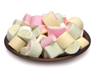 Marshmallows in a brown bowl isolated on a white background.