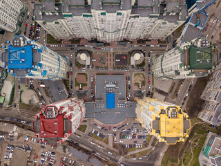 Aerial drone view. Residential high-rise buildings with colored roofs in Kiev.
