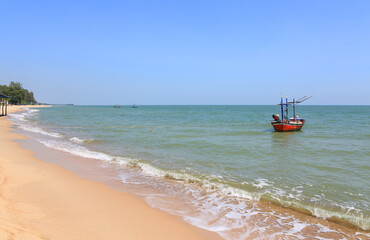 Fishing boat floating on sea side thailand beach.