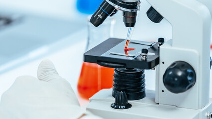 close up. microscope is on the table in the lab.