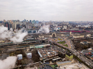 Obraz premium Aerial drone view. The building of the Kiev railway station through the white smoke from the chimneys.