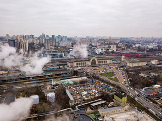 Obraz premium Aerial drone view. The building of the Kiev railway station through the white smoke from the chimneys.