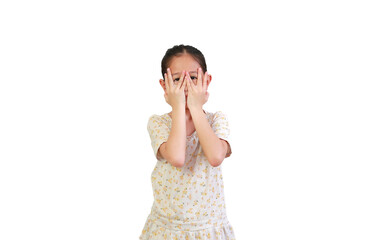 Portrait little asian girl covering eyes while watching through gap in fingers isolated on white background with clipping path. Kid peeking by her hands