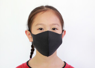Close up asian little girl wear face mask to protects against spread of covid-19 or coronavirus isolated over white background