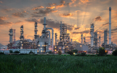 Obraz na płótnie Canvas Industry Overview The refinery is an industrial area with sunrise and cloudy skies, oil and natural gas storage tanks, the refinery industry.