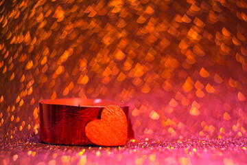 
red candle and heart on red background