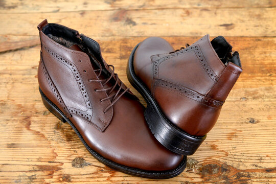 Stylish men's shoes on old wood background