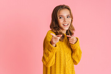 Happy beautiful girl smiling and pointing fingers at camera