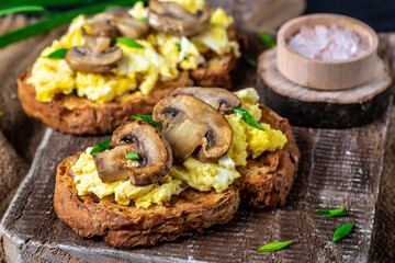 wholewheat toast with scrambled eggs with mushrooms and cottage cheese. healthy breakfast or brunch. banner, menu recipe place for text, top view