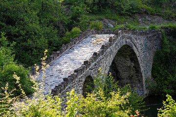 Fototapeta na wymiar View of the traditional stone Stambeki Bridge in Thessaly, Greece.