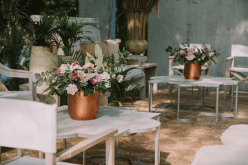 wooden tables and chairs with colorful flowers