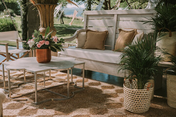 wooden tables and chairs with colorful flowers